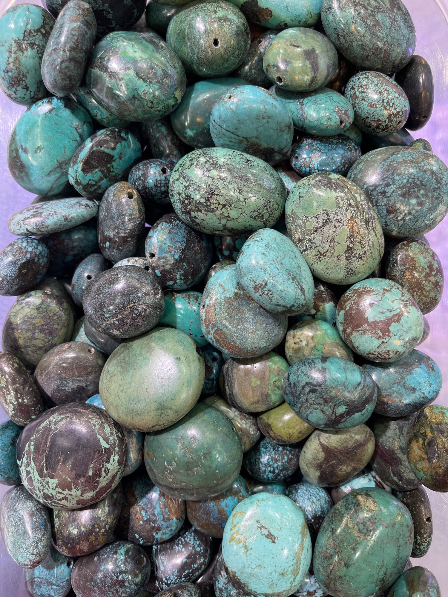 Turquoise beaded stone.