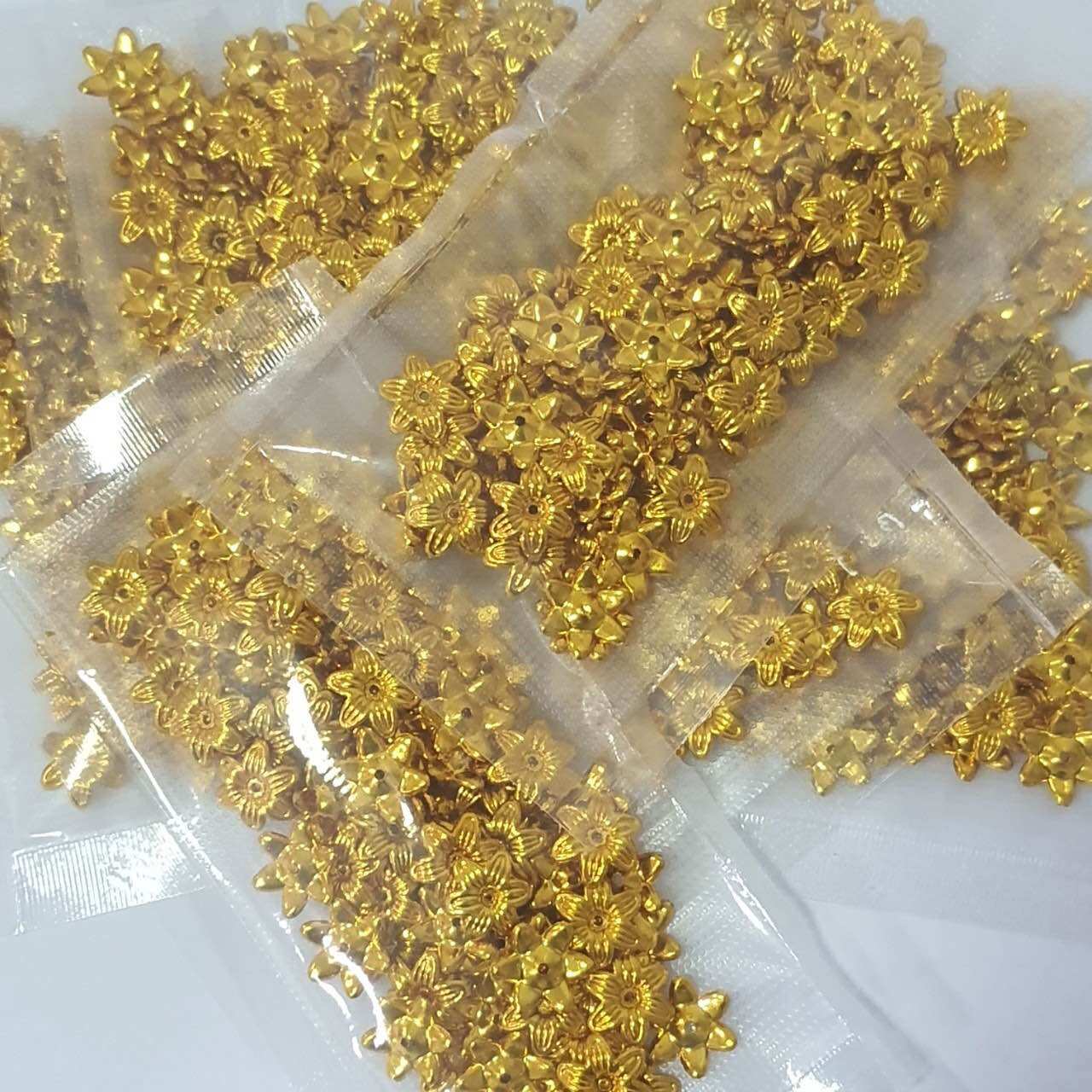 ดอกพิกุล สำหรับทำเหรียญโปรยทาน จำนวน 100 ดอก ราคาถูก