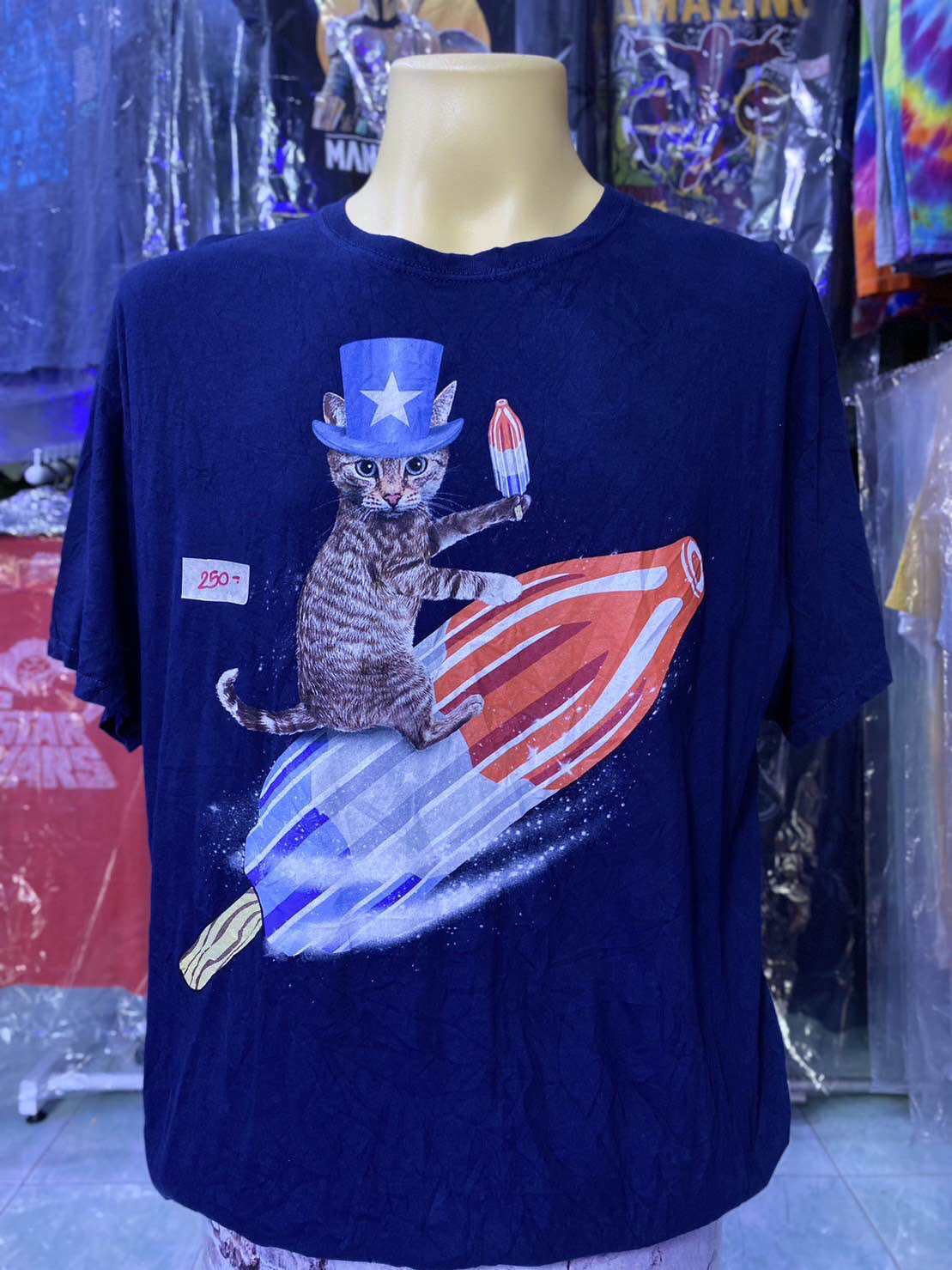 Cat riding a 2024 bomb pop shirt