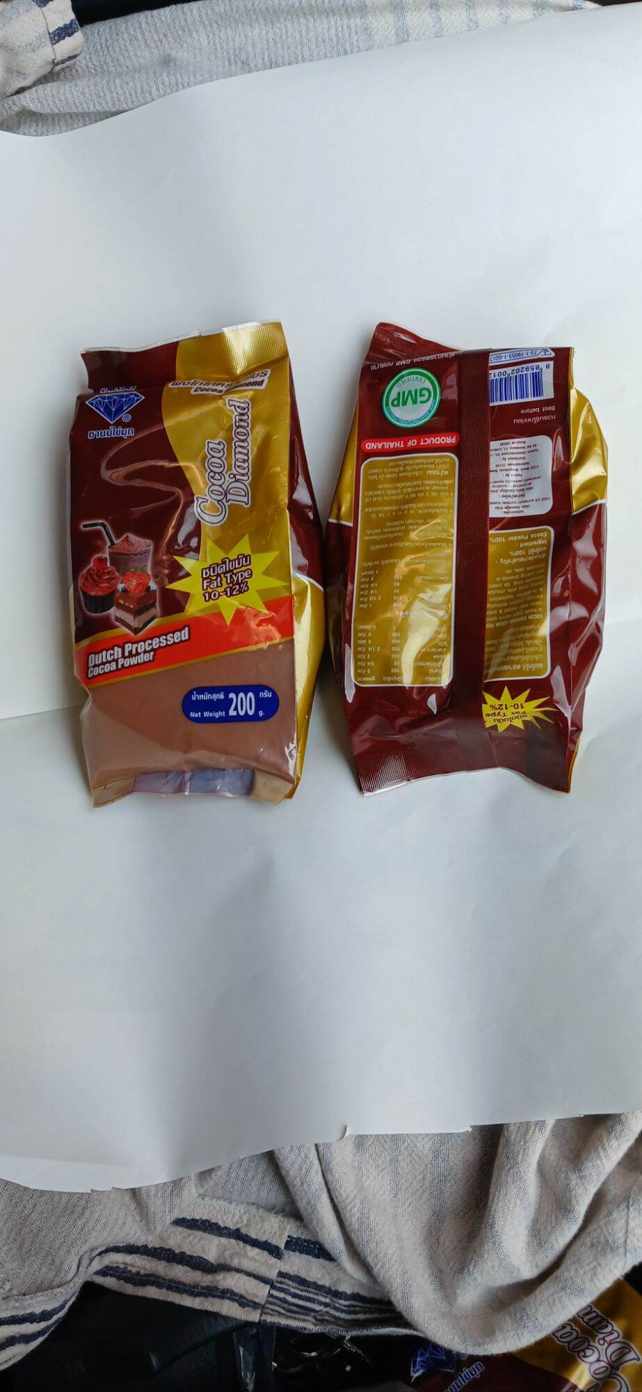 ผงโกโก้ตราเพชรขนาด 200กรัมผลิตจากเมล็ดโกโก้แท้ชงดื่มได้ทั้งร้อนและเย็นใช้ทำเค็กและเลเกอรี่ อร่อย ราคา 68 บาท*ส่งฟรี